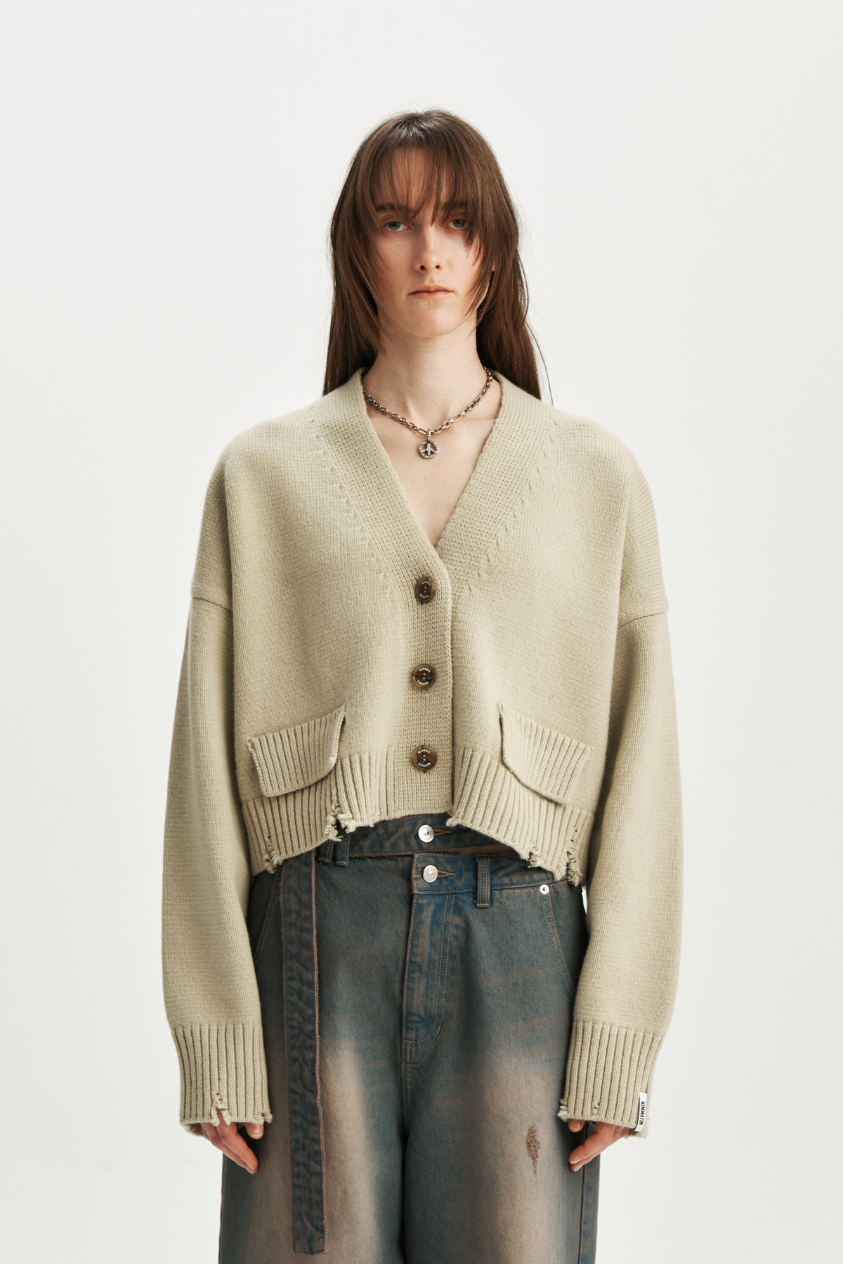DAMAGE CROP KNIT CARDIGAN IN BUTTER